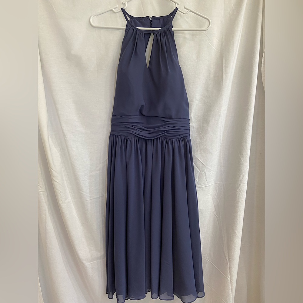 JJ’s House A-line Scoop Chiffon Cocktail Dress with Ruffle. Color is Stormy.